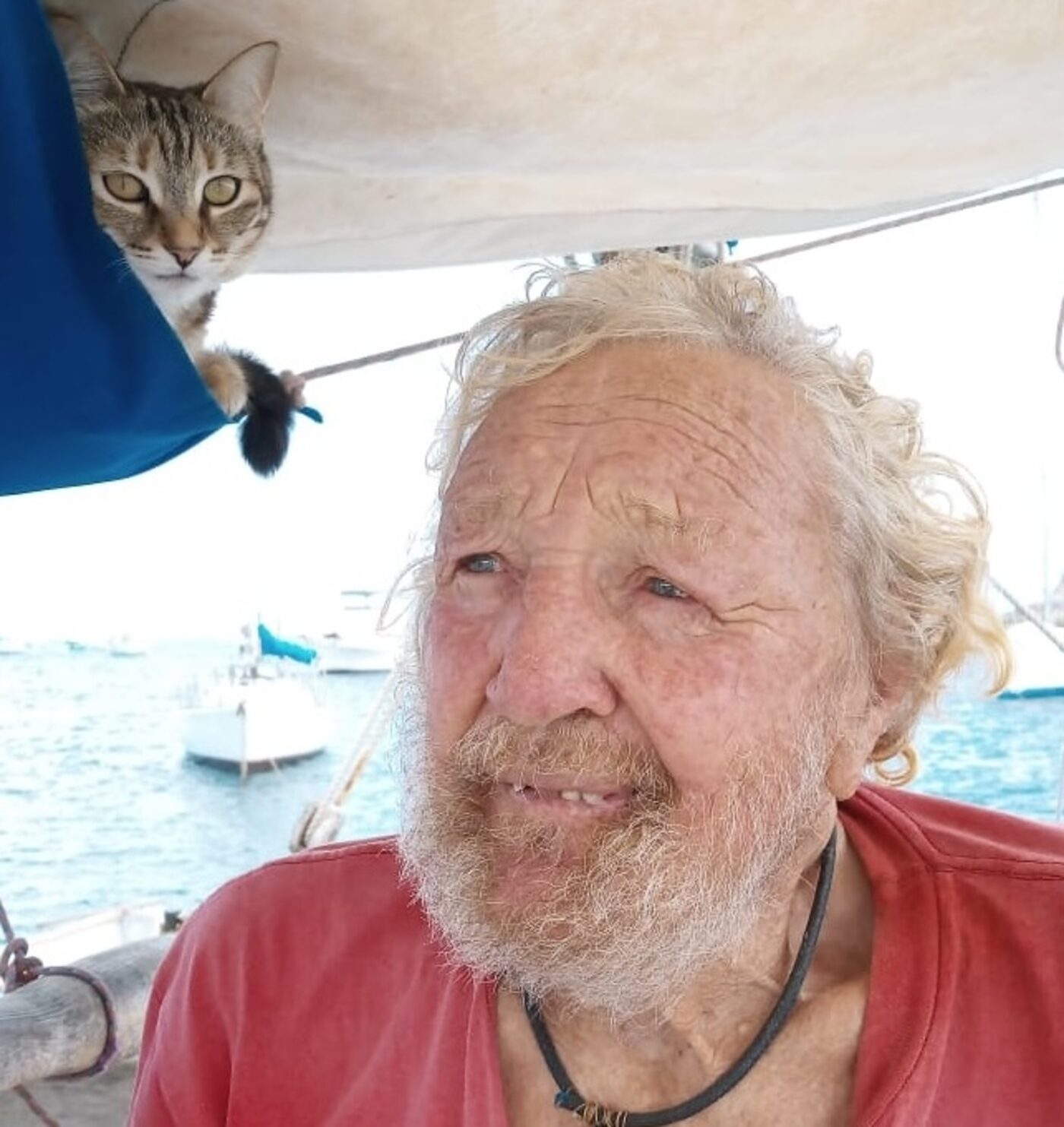 Paul Johnson aboard Cherub with the ship's cat